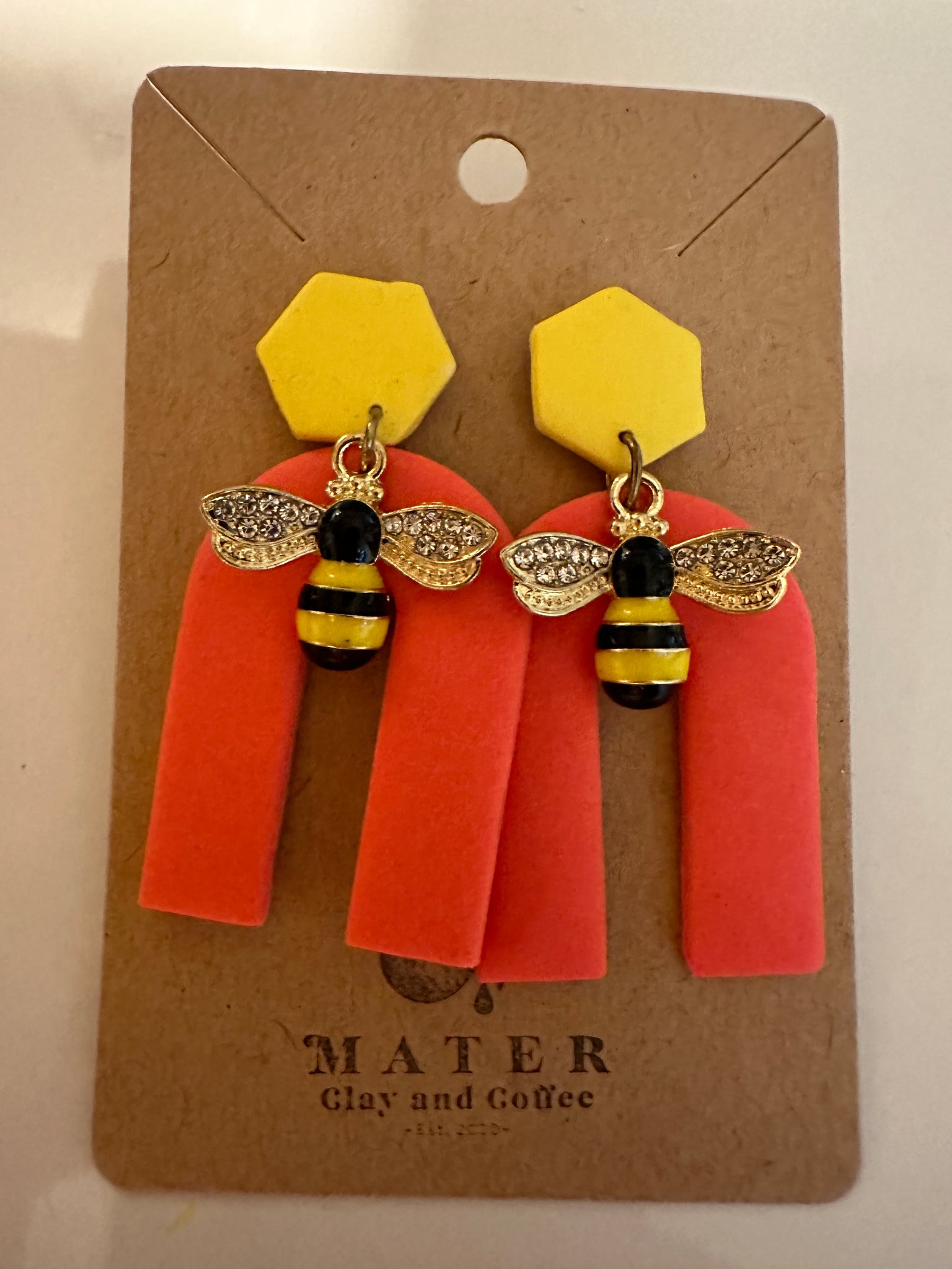 Coral and yellow arches with bees